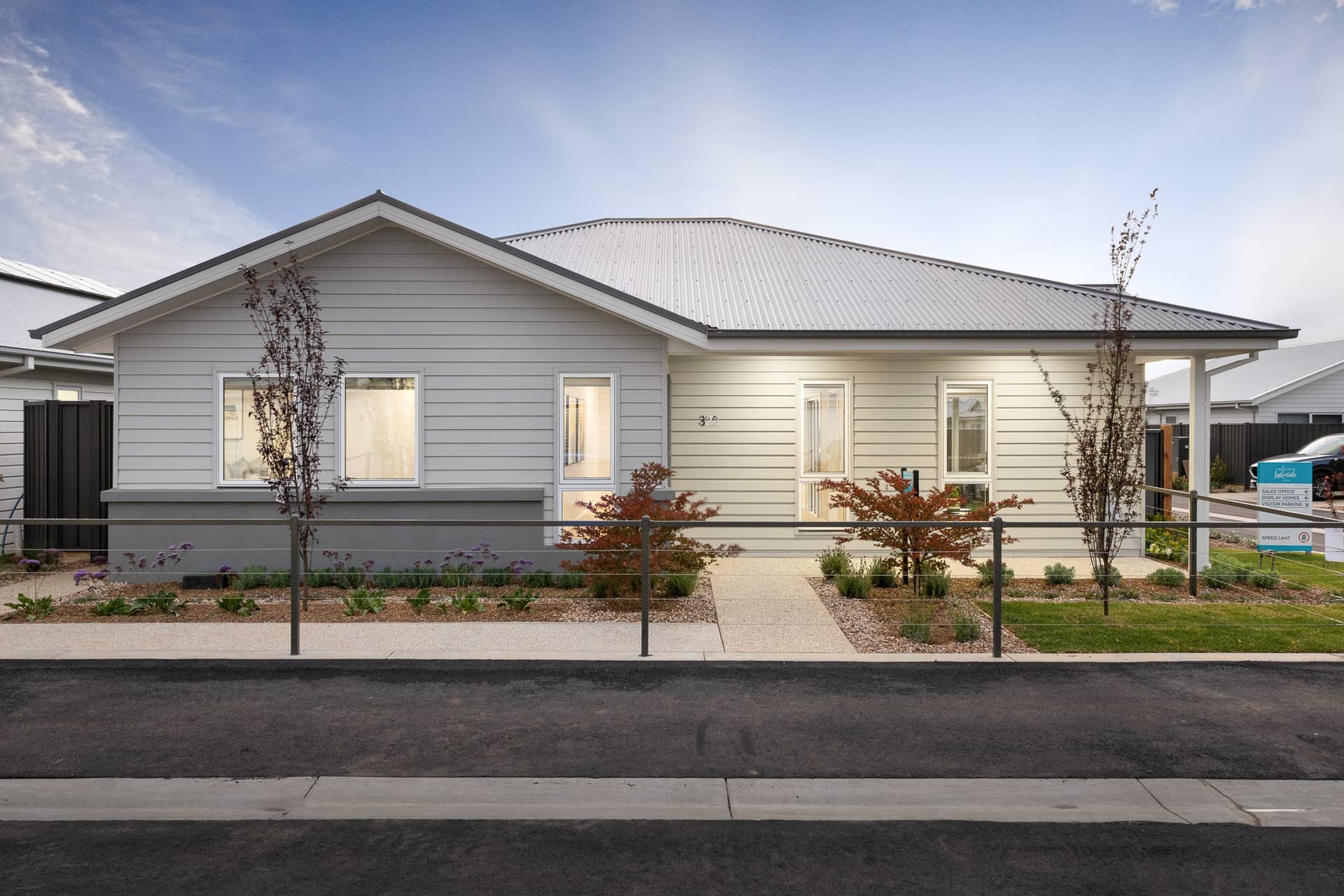 Ingenia Lifestyle community land lease home with light grey siding and white trim.