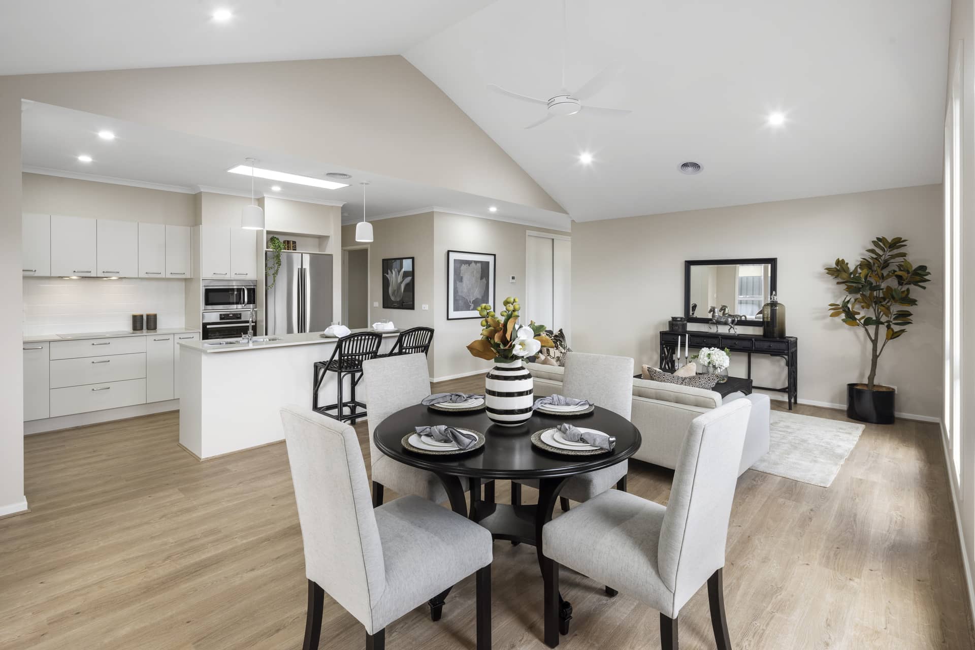 Open-plan living and dining area with a modern kitchen and neutral decor.