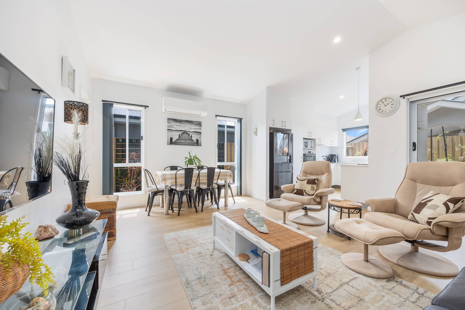 Interior of an Ingenia Lifestyle home featuring a living and dining area with light wooden floors.