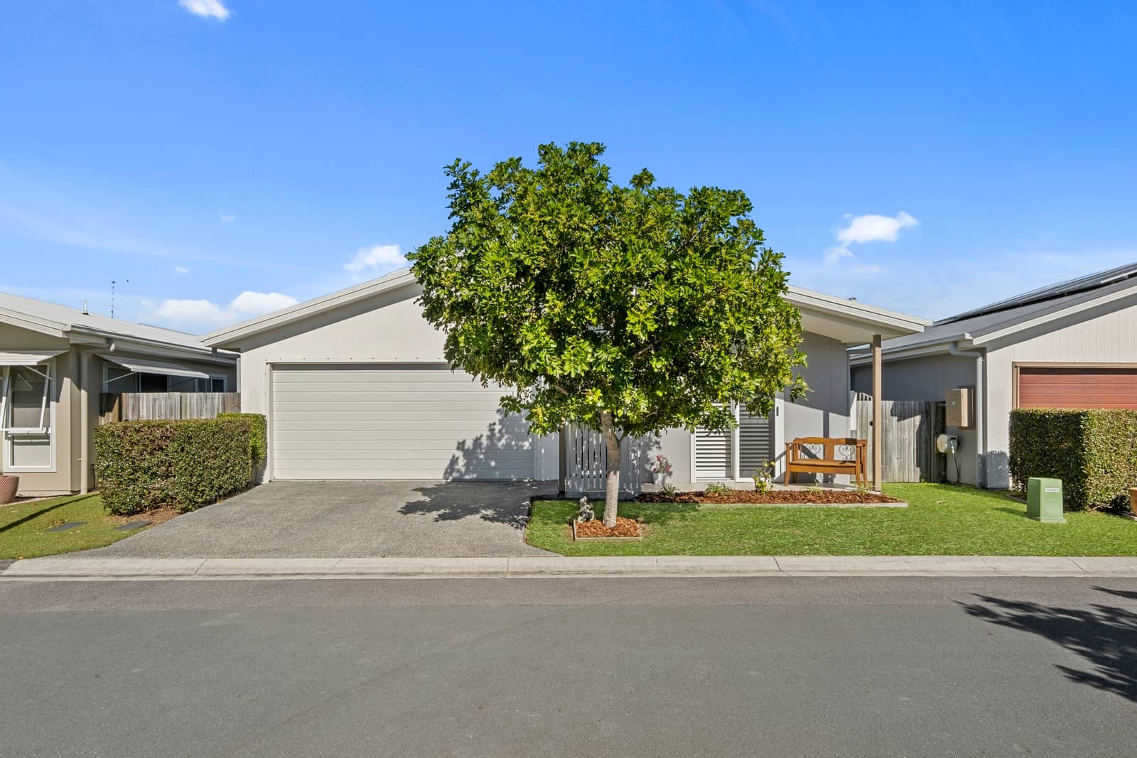 A low-maintenance land lease home in an Ingenia Lifestyle community with a garage and green surrounds.