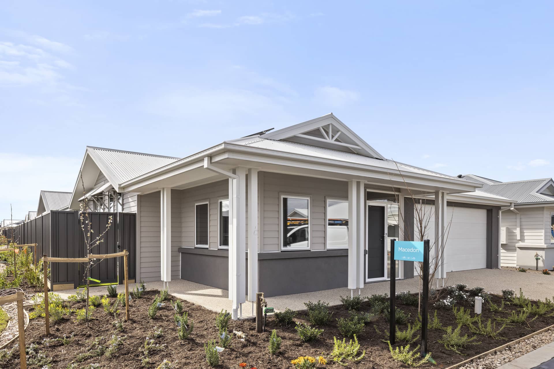 Ingenia Lifestyle community home exterior with a light grey facade and a covered porch.