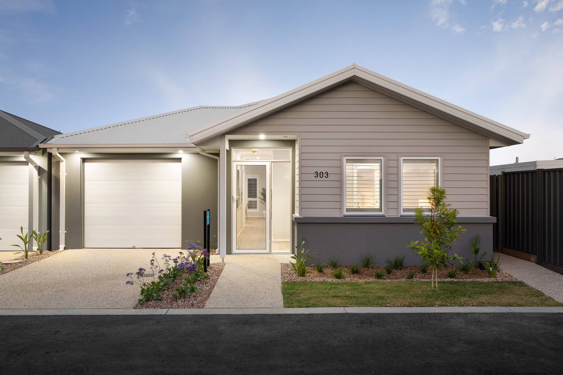 Exterior of a modern Ingenia Lifestyle land lease home with a garage and entrance.