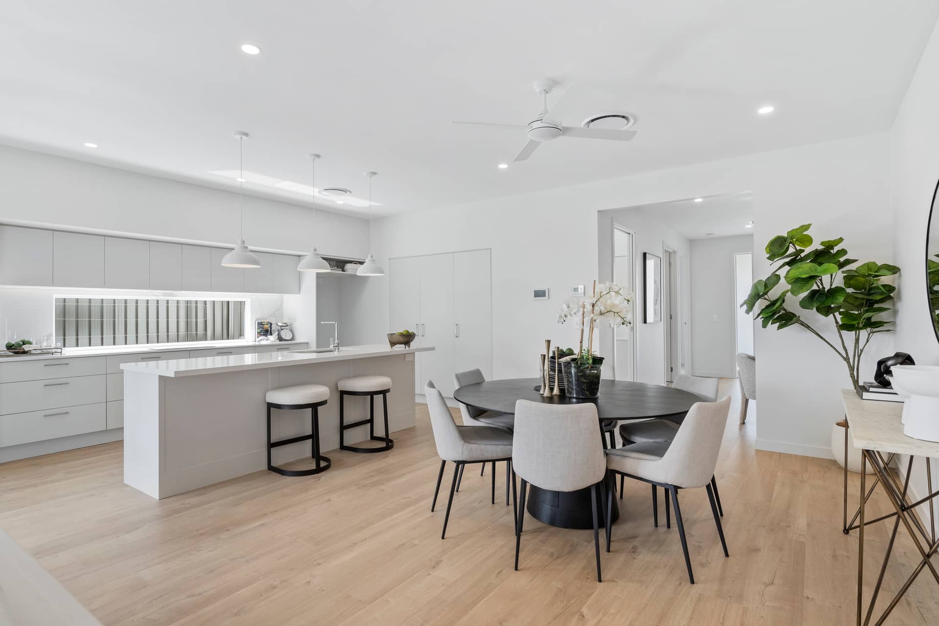 Modern open-plan kitchen and dining area in an Ingenia Lifestyle community.