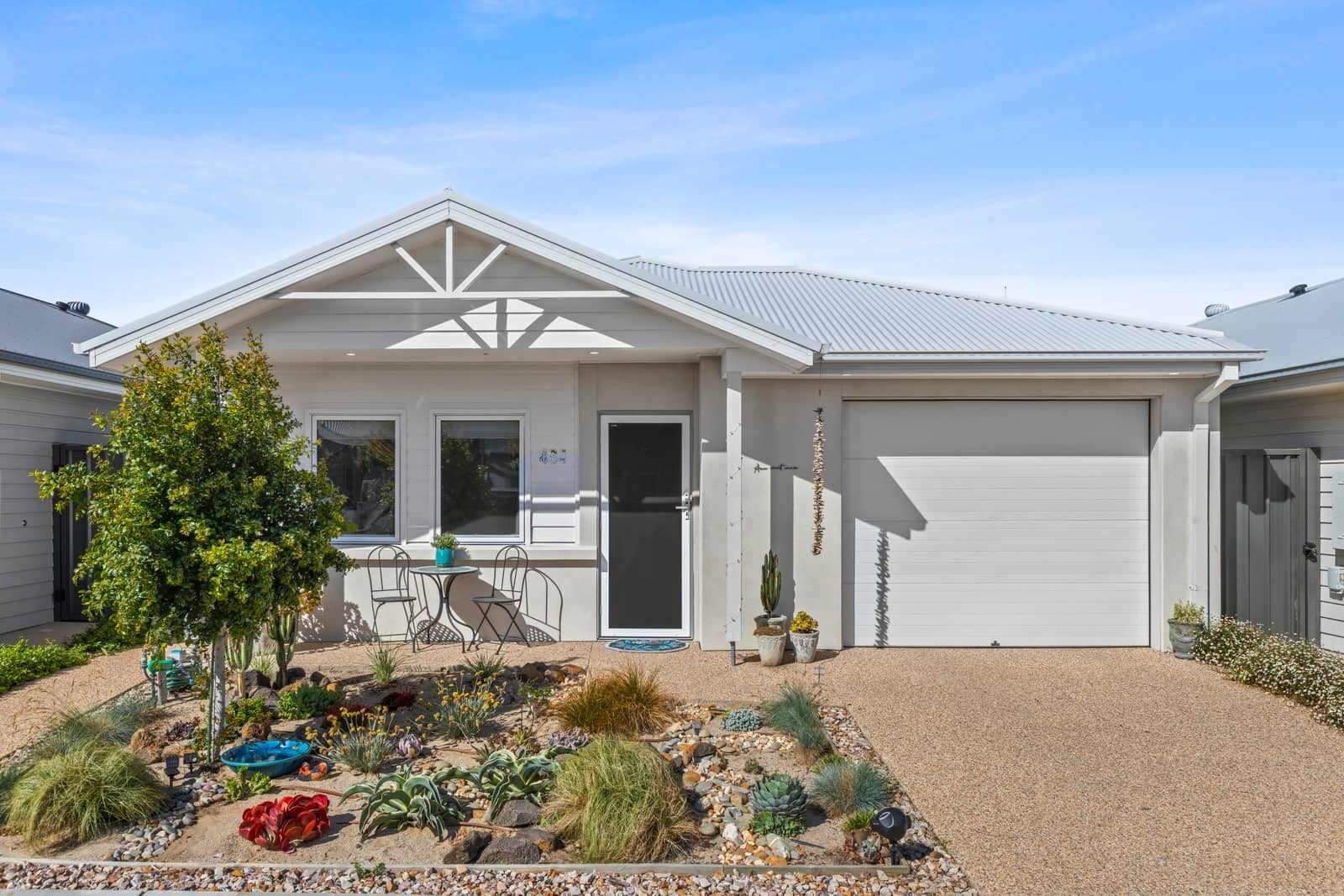 Ingenia Lifestyle land lease home with a modern facade, garage, and low-maintenance garden.