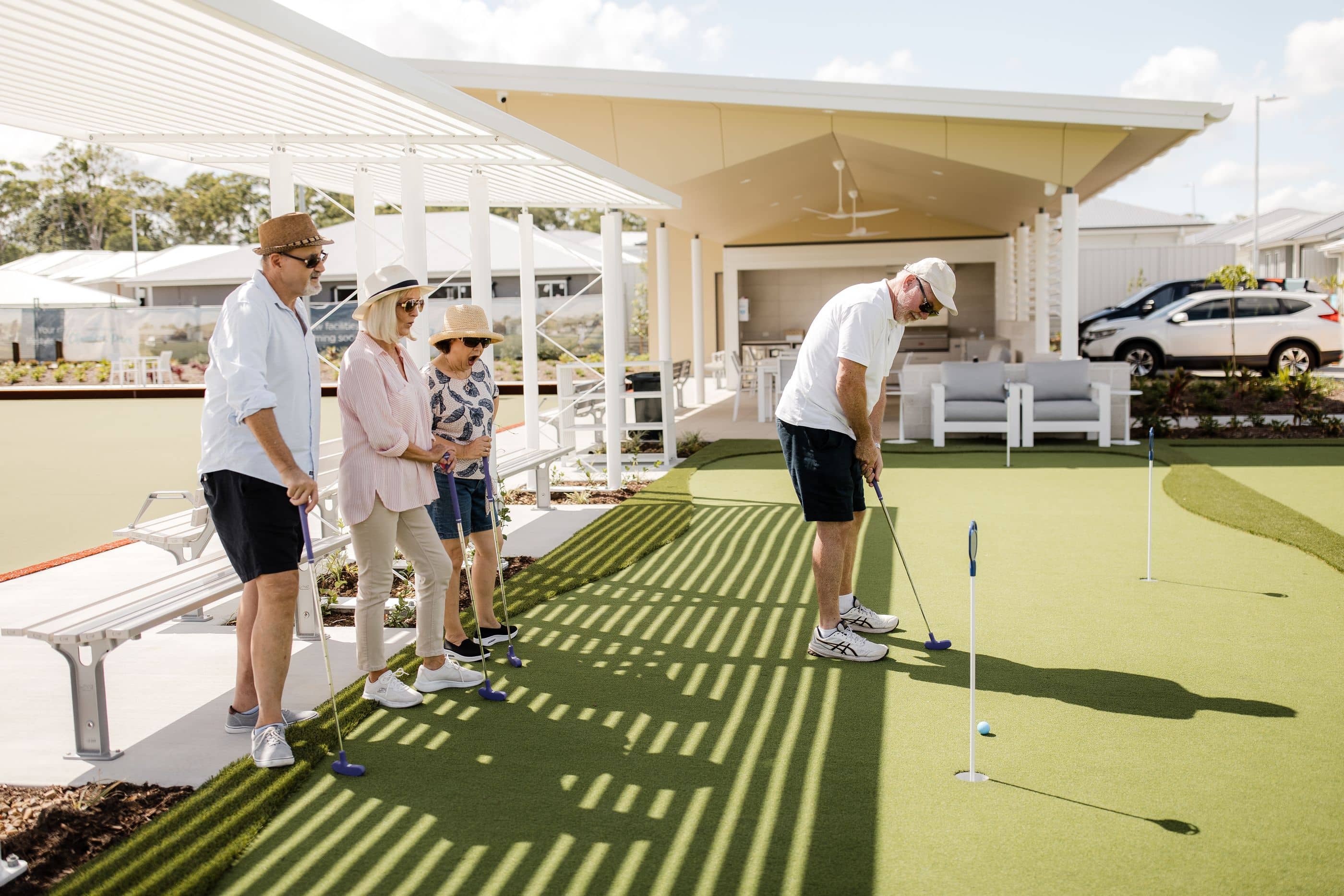 Residents playing mini-golf at an Ingenia Lifestyle community amenity.
