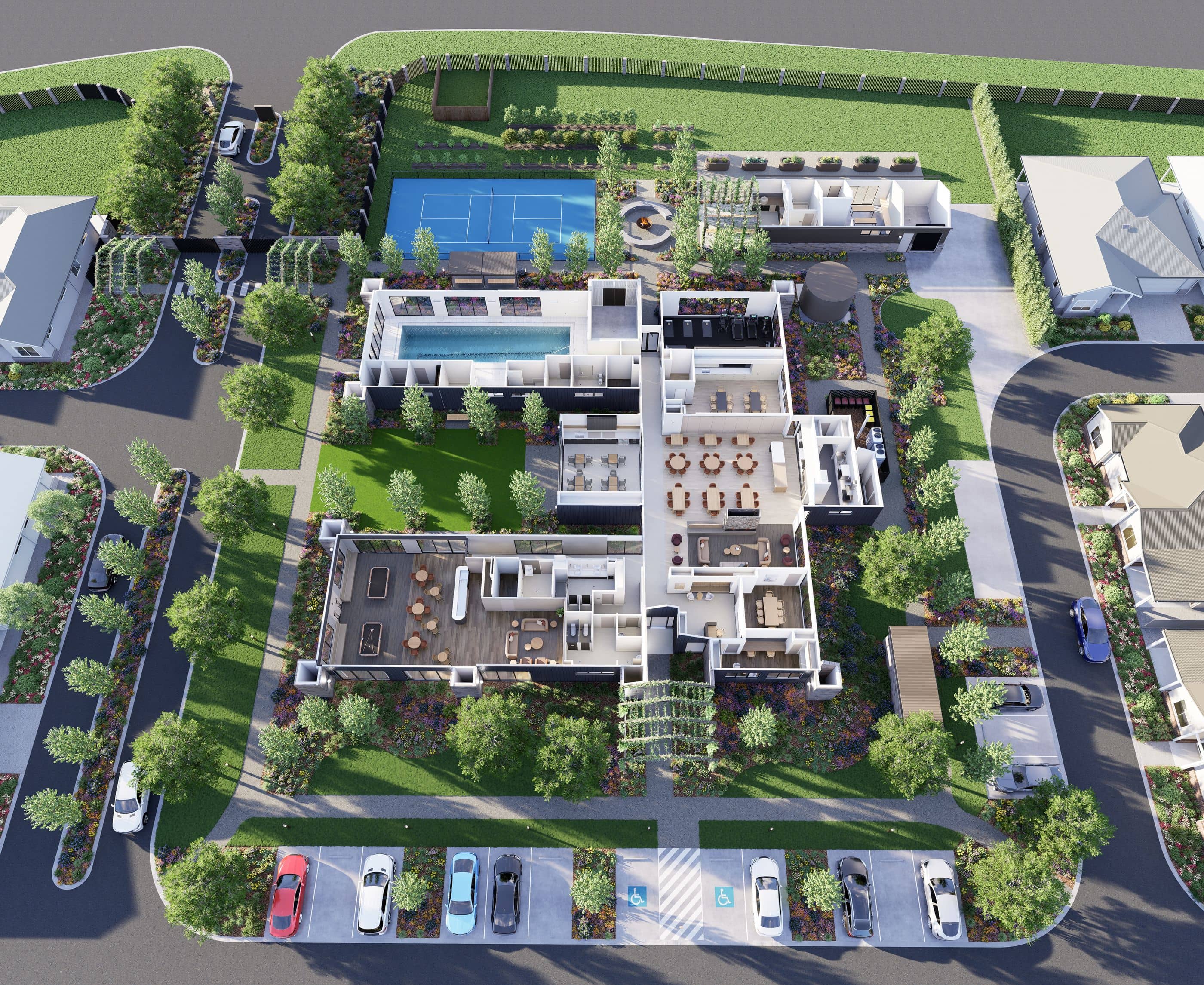 Overhead view of Ingenia Lifestyle community amenities, including a pool, tennis court, and residential homes.
