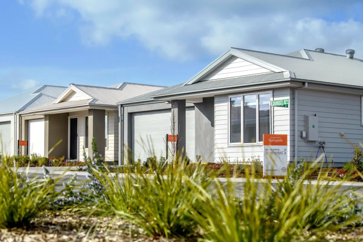 Modern land lease homes in Ingenia Lifestyle Springside community, with garage doors and landscaping.