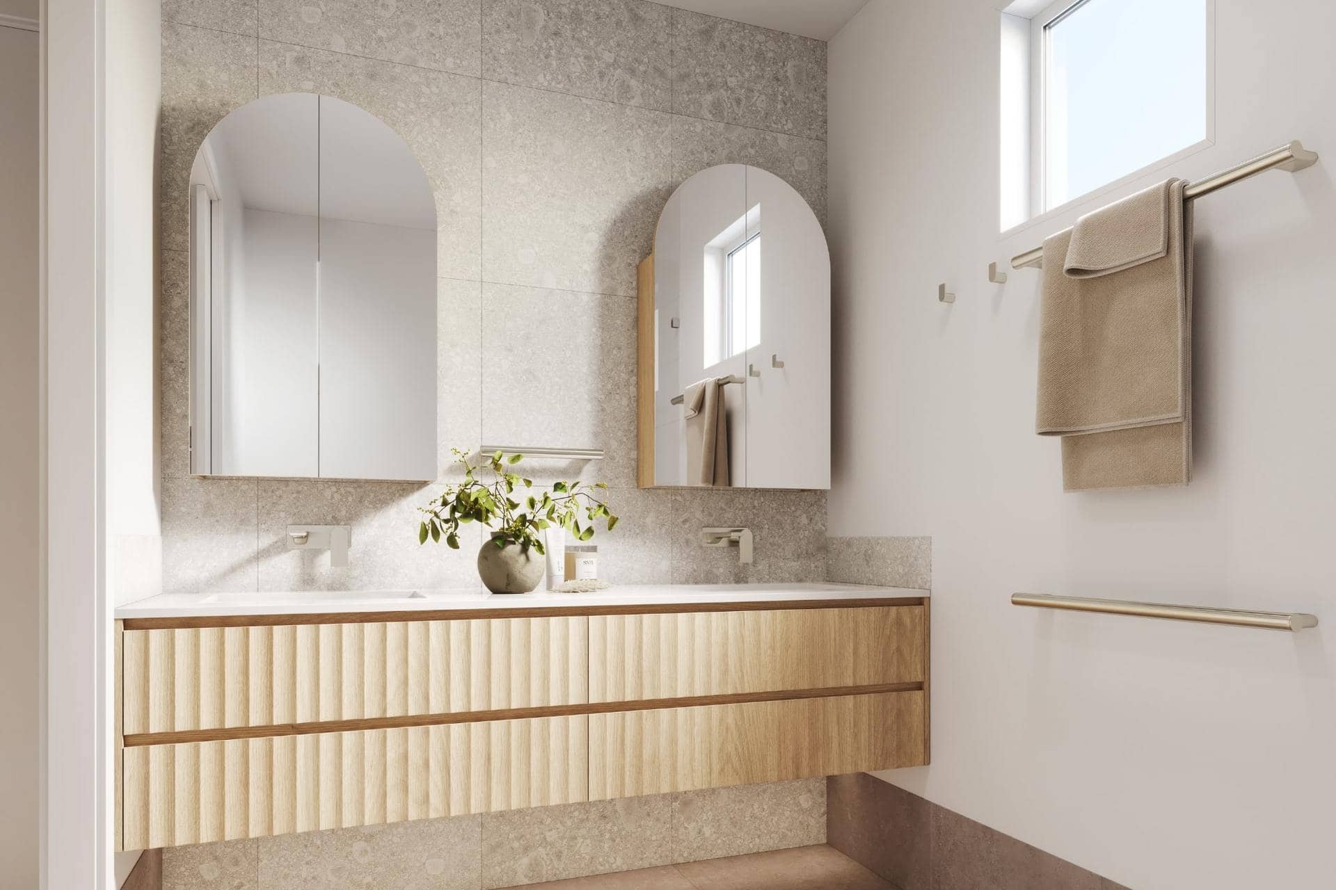 Modern bathroom with a double vanity, textured light wood cabinet, twin arched mirrors, and grey tiled walls.