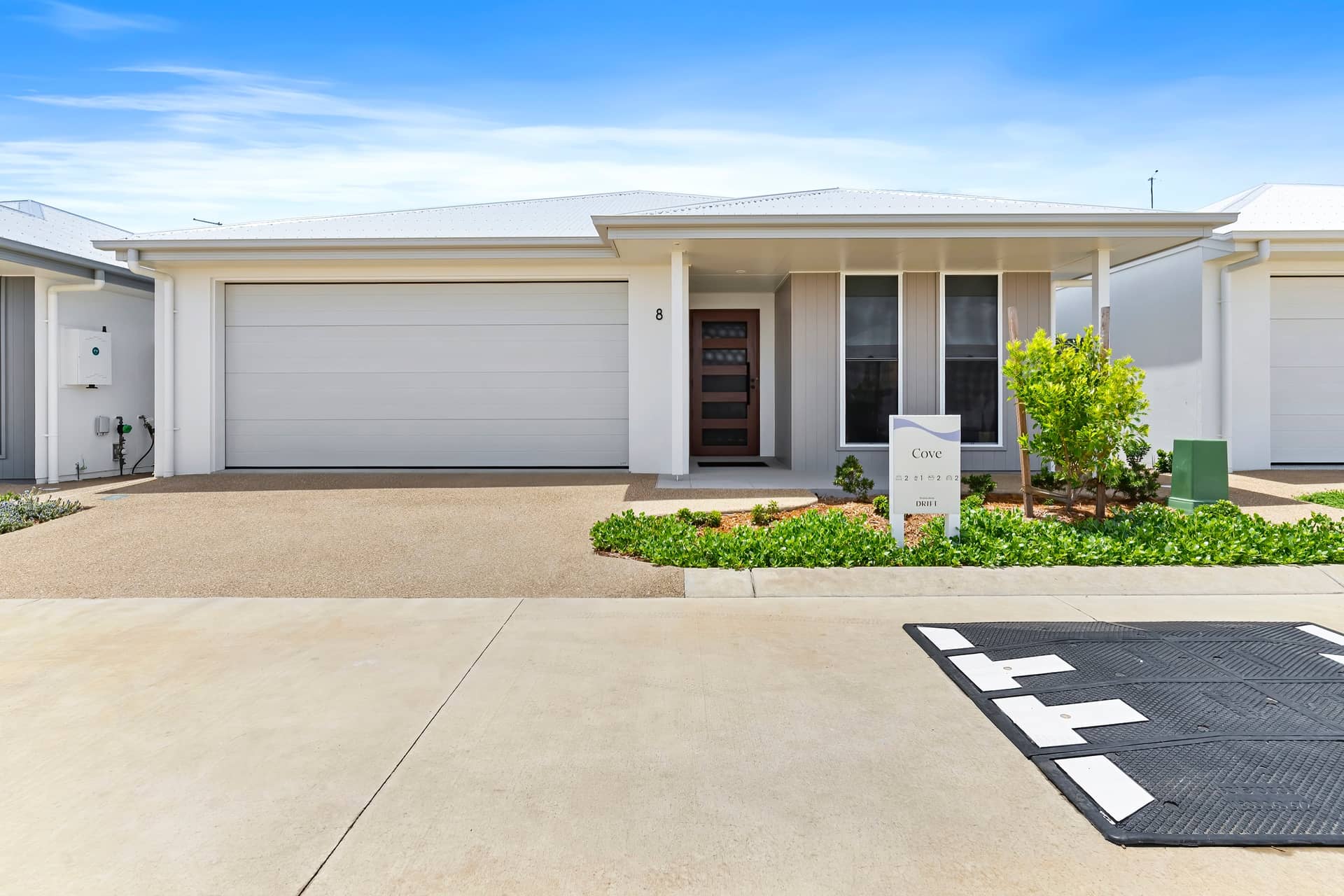 Modern land lease home with a double garage and landscaped garden in an Ingenia Lifestyle community.