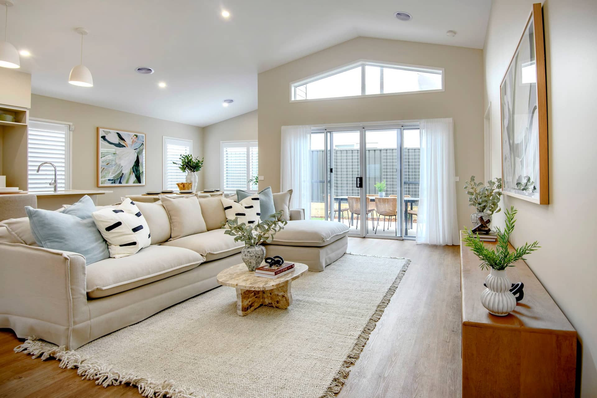 Spacious living area in an Ingenia Lifestyle community home with a large sofa and coffee table.