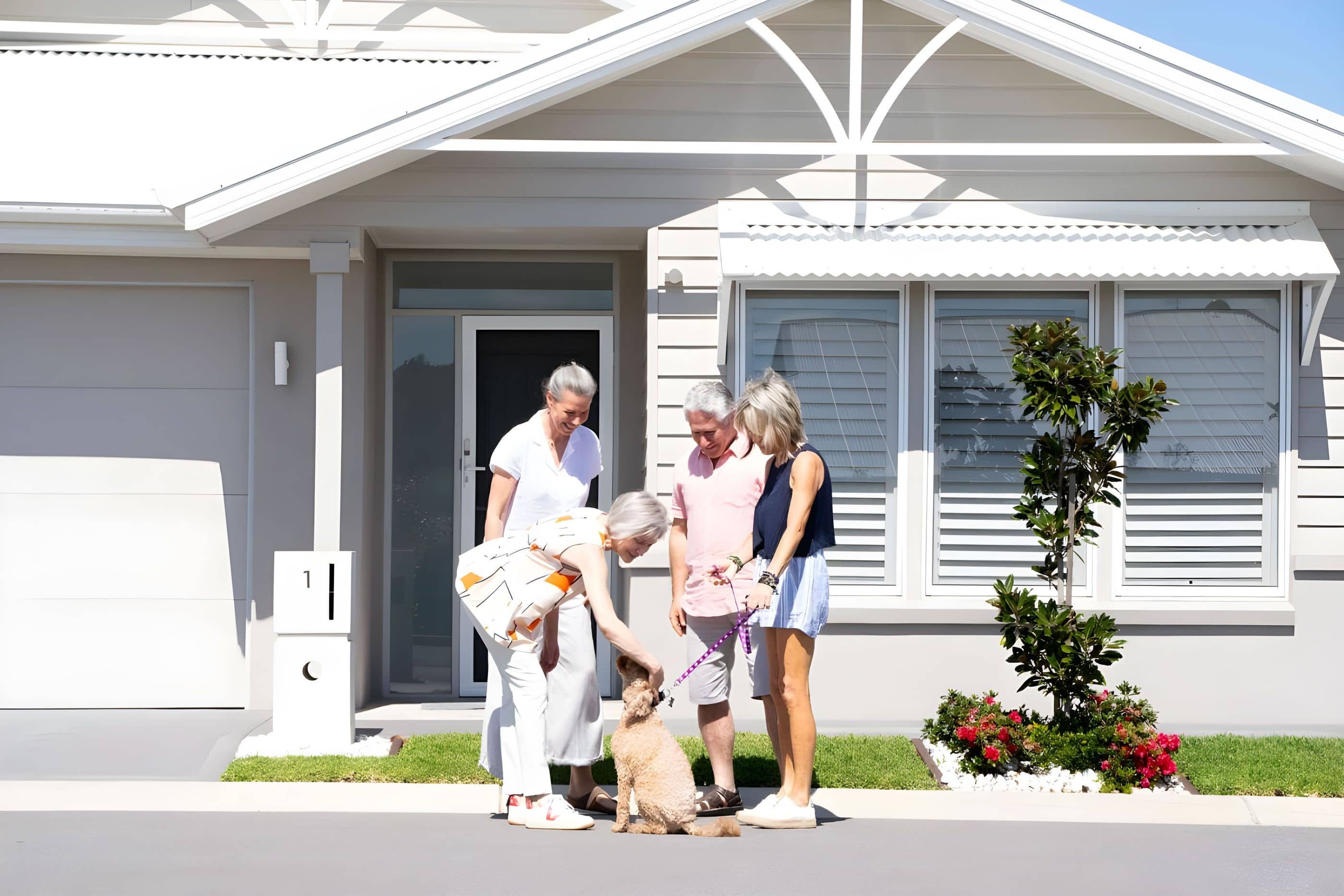 Couples meeting outside home with dog in the community