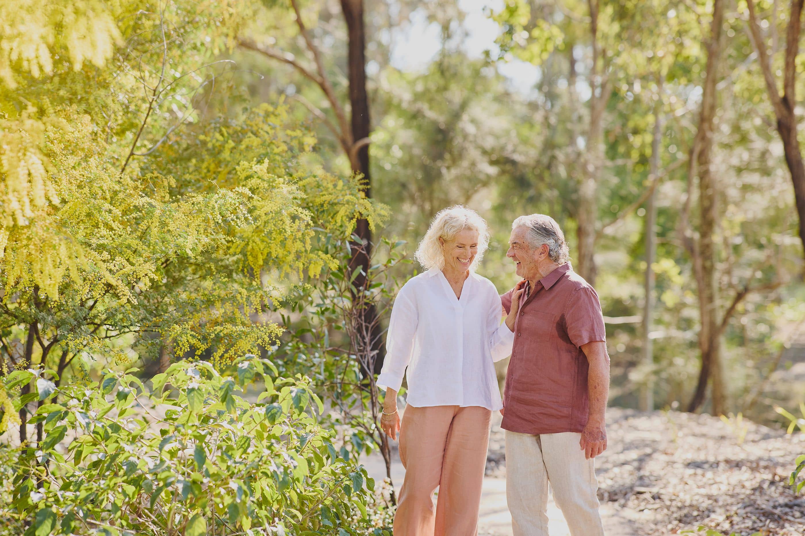 A couple enjoying a walk on a bush trail