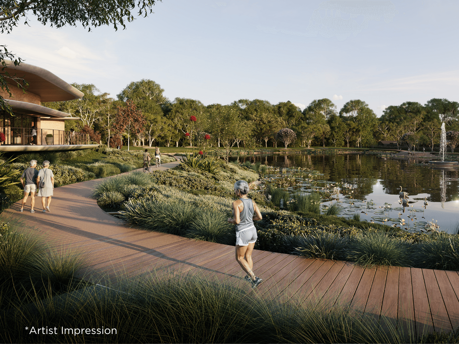 People walking, cycling, and jogging on a boardwalk next to a lake with a community building in an Ingenia Lifestyle community.