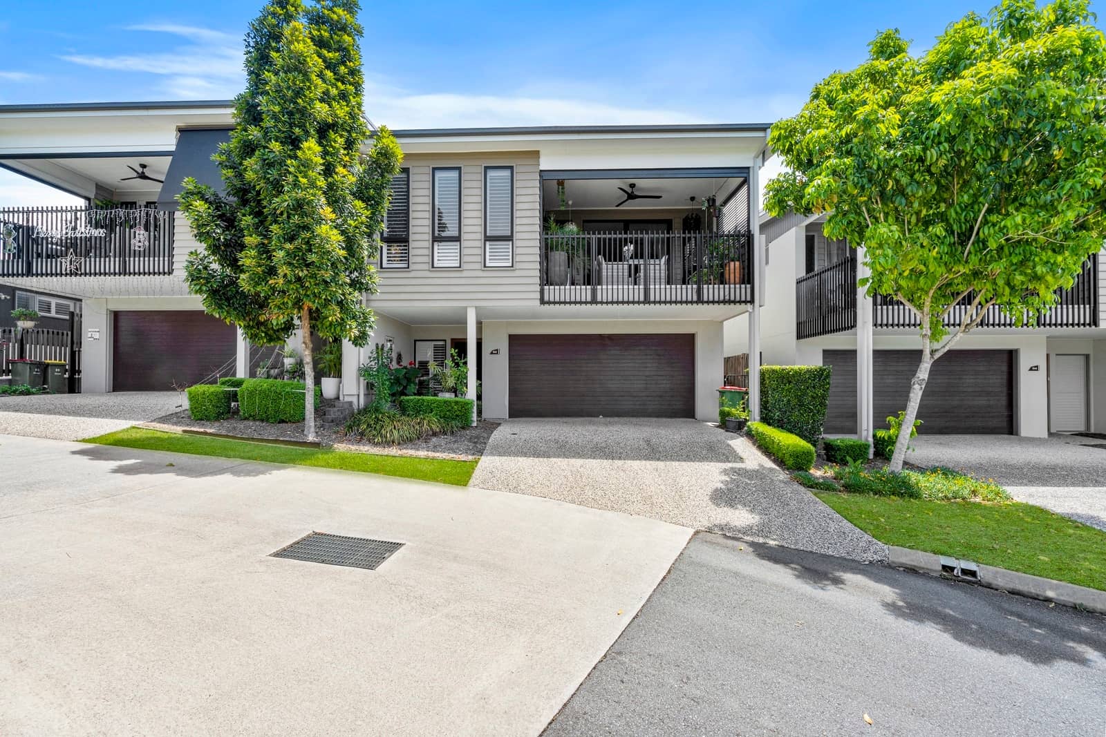 Modern land lease homes in an Ingenia Lifestyle community with manicured gardens and paved driveways.