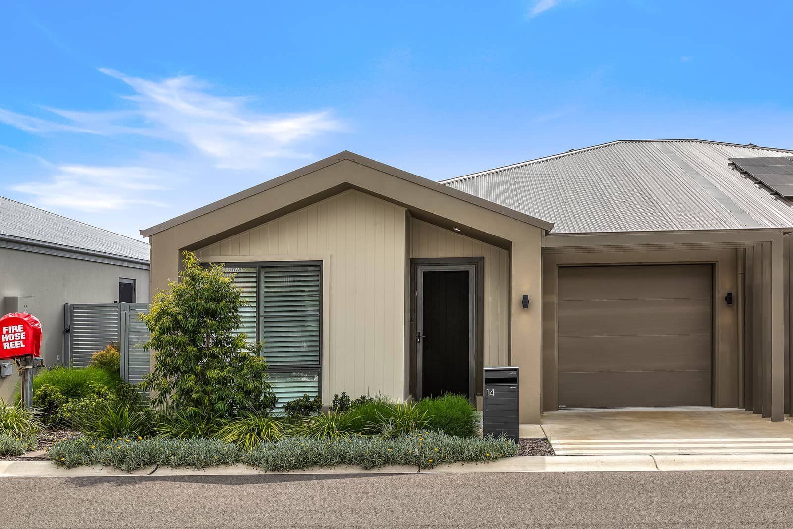 Modern Ingenia Lifestyle land lease home exterior with a single garage and landscaped garden.