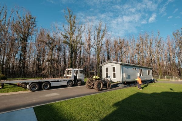 Replacement house arrives on truck