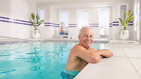 over 55s guy in community pool