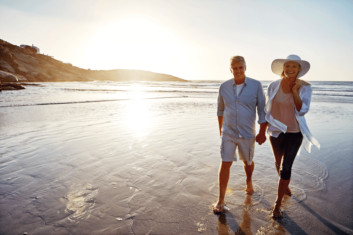 Ingenia Lifestyle Couple walking on the beach